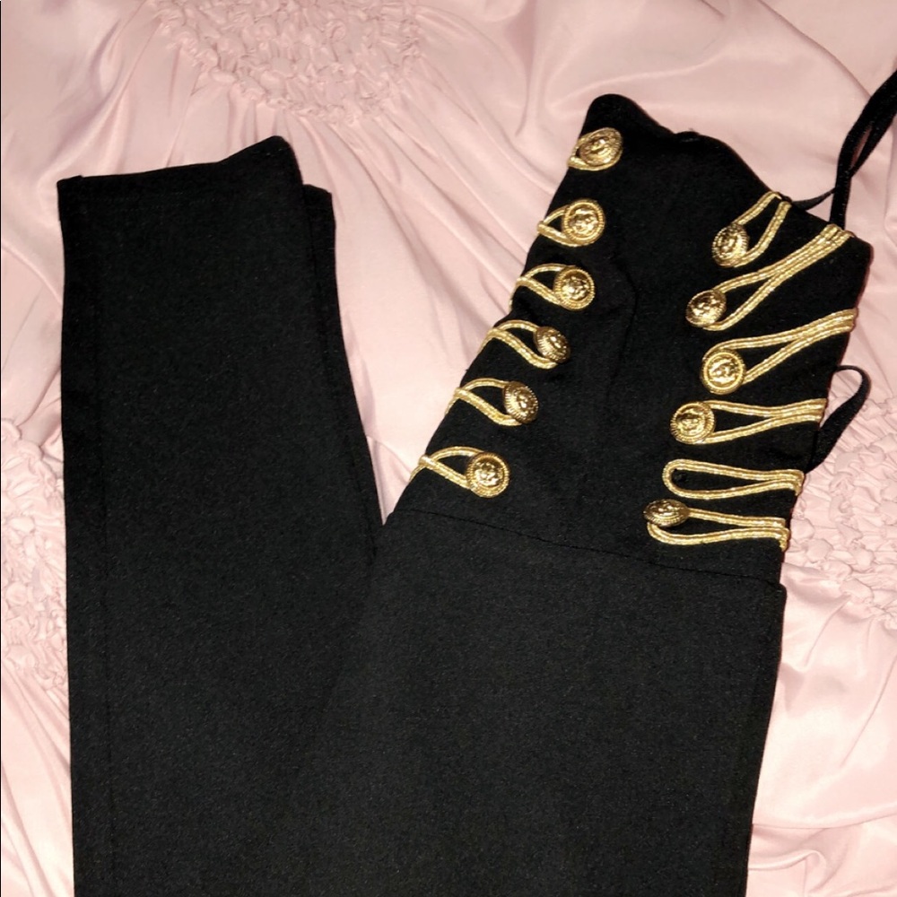 Black romper size large with gold studs